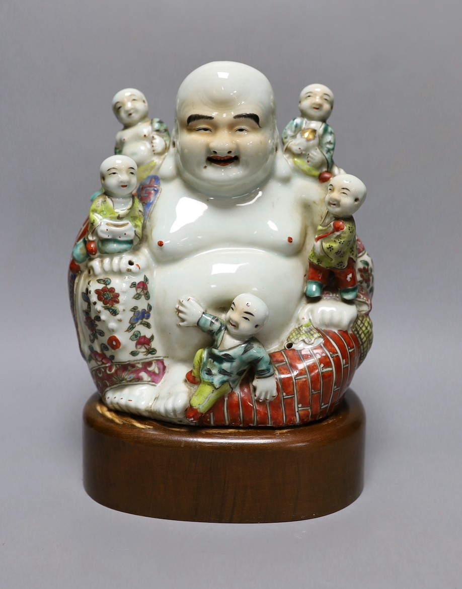 A Chinese enamelled porcelain Budai group, Republic period, on stand 25cm